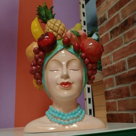 Fruit-inspired home accessories in a bright, neutral interior